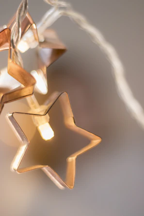Golden stars softly illuminating a serene crystal altar in warm beige tones.