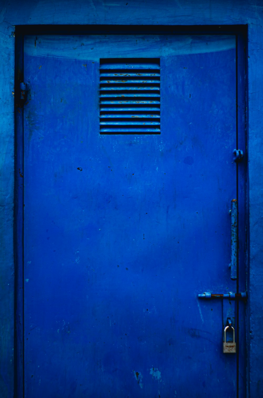 blue steel door with white steel door handle