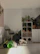 A cozy indoor pet daycare with cats lounging comfortably on soft cushions.