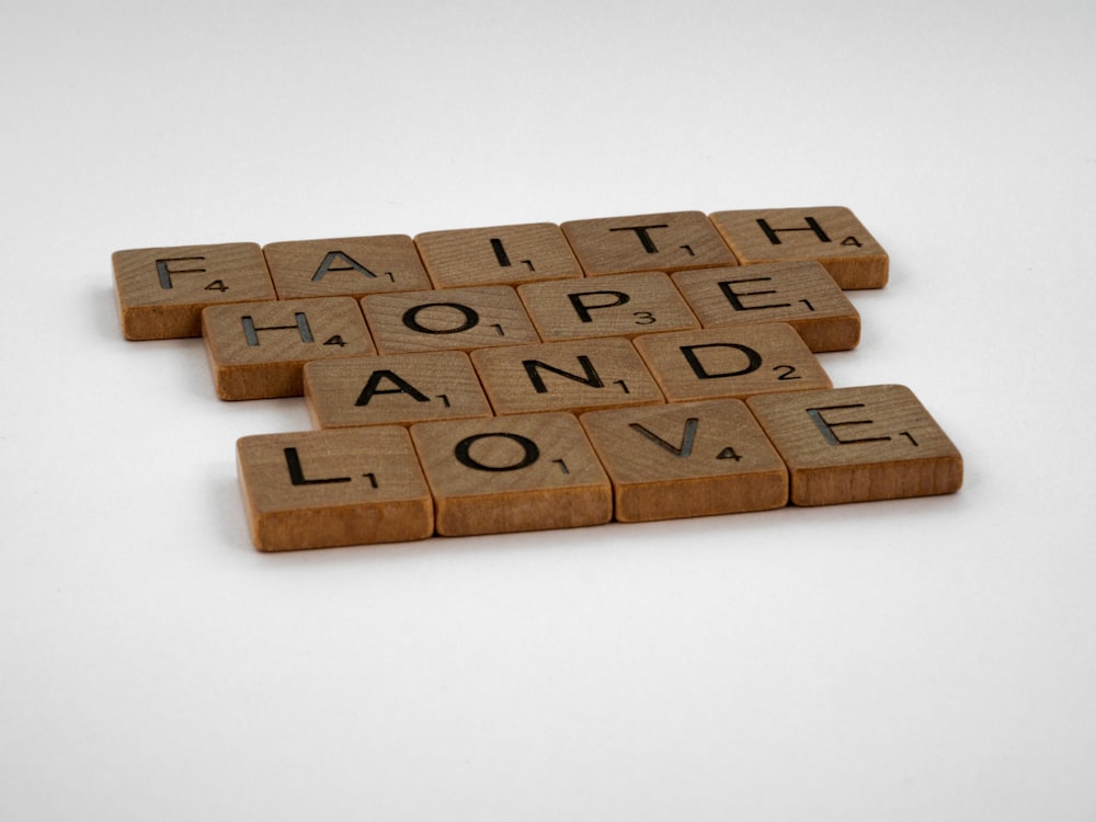 brown wooden puzzle piece on white table