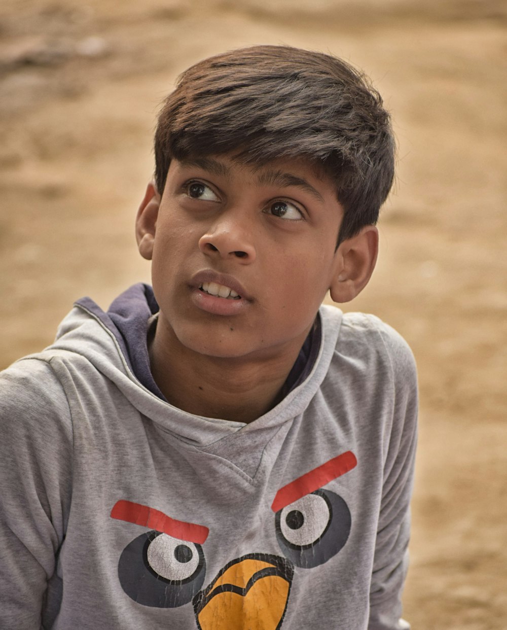 boy in gray and red crew neck shirt