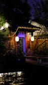 Charming stone porch entrance with warm lighting highlighting the textured surface.