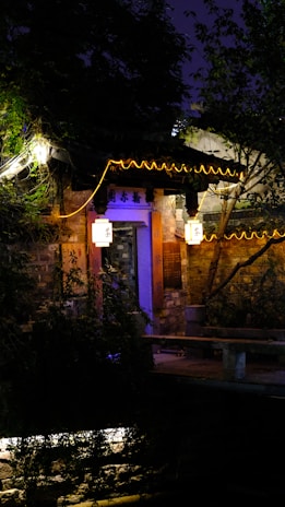 The welcoming entrance of Karnawati Bhawan with warm lighting in the evening.