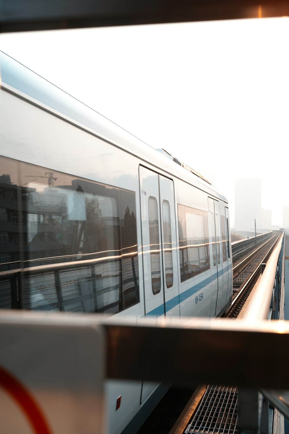 white and blue train on train station during daytime