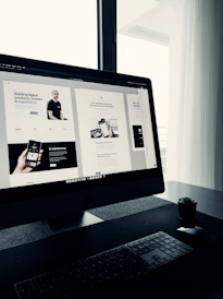 A vibrant workspace showing a designer creating a modern website on a laptop.