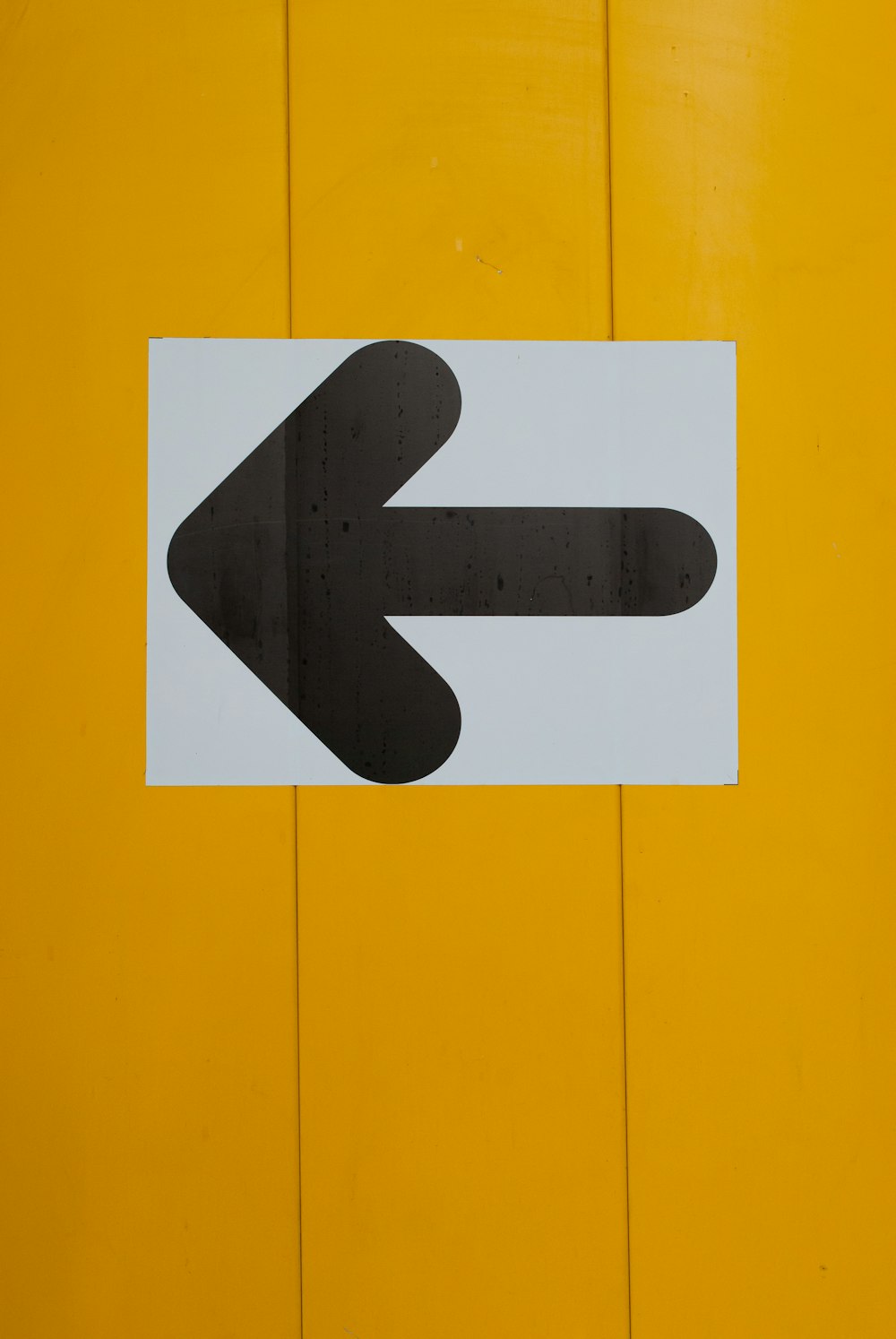 white and black arrow sign