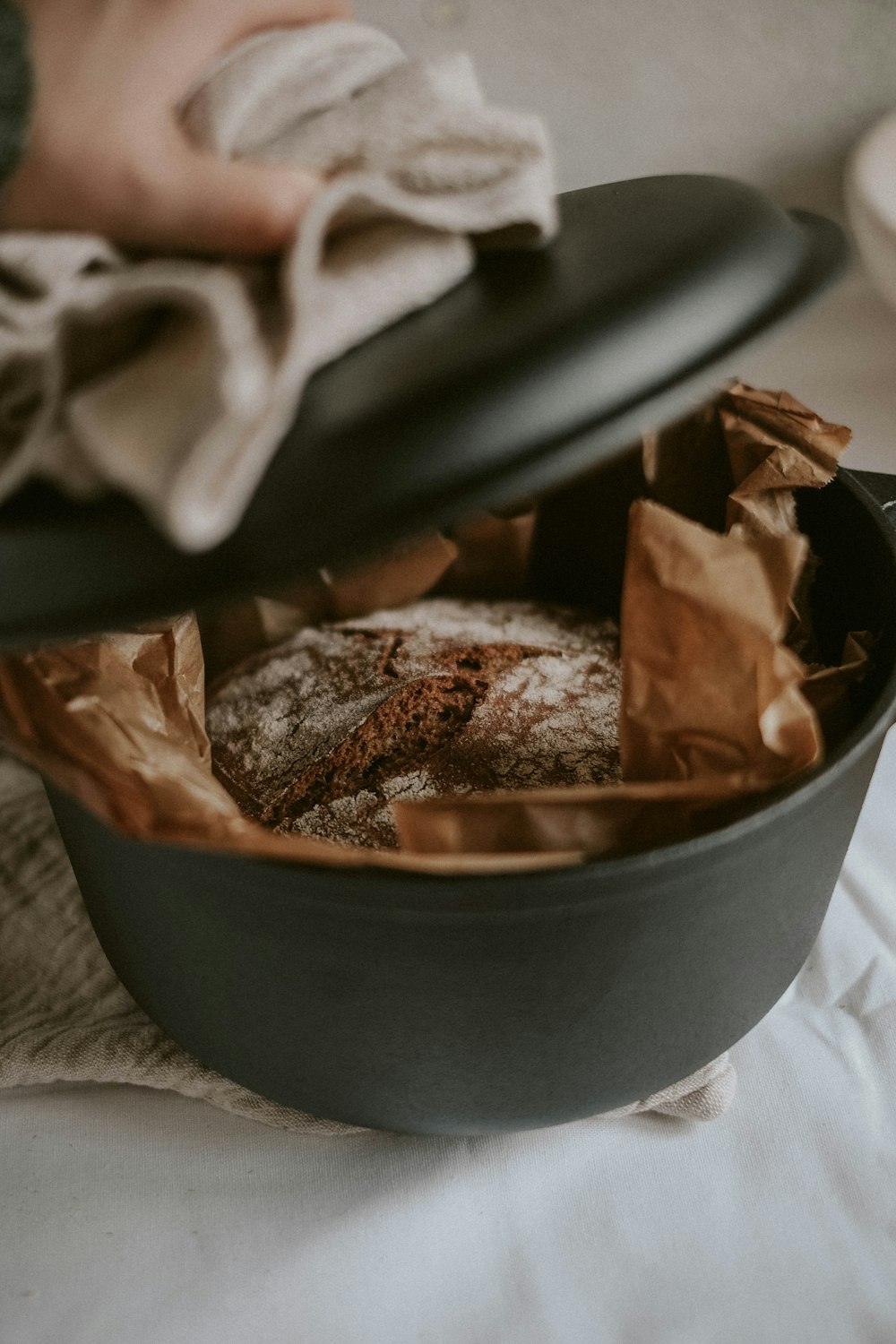 brown and white food in black bowl