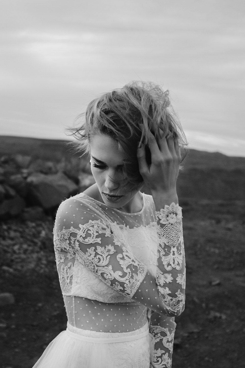 grayscale photo of girl in floral shirt