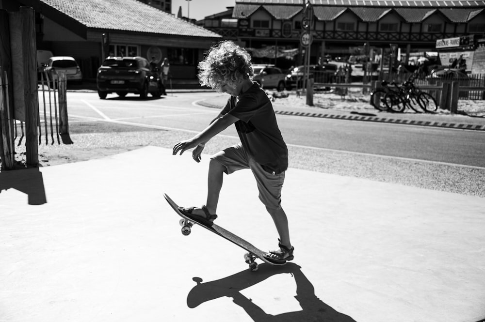 man in black long sleeve shirt riding skateboard