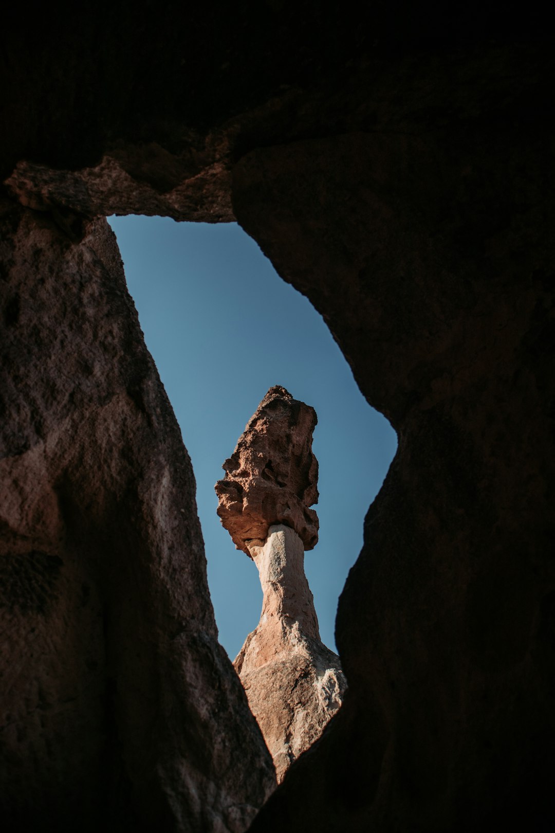 brown rock formation under blue sky during daytime