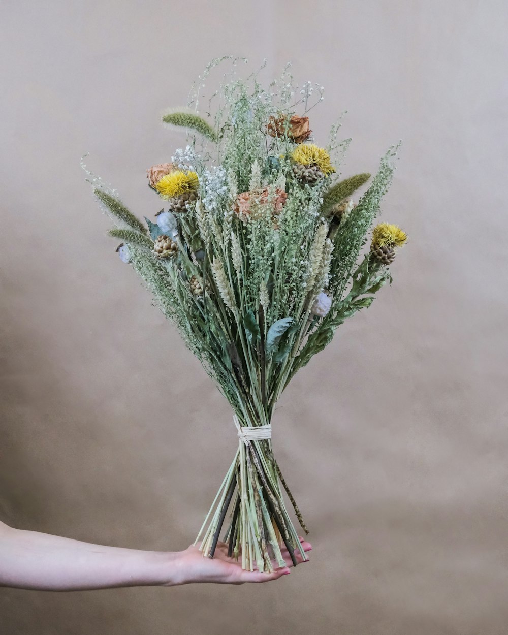 yellow and red flowers in clear glass vase