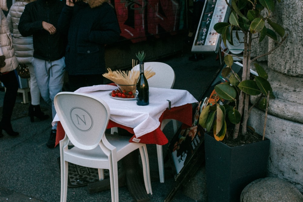 white plastic table with chairs