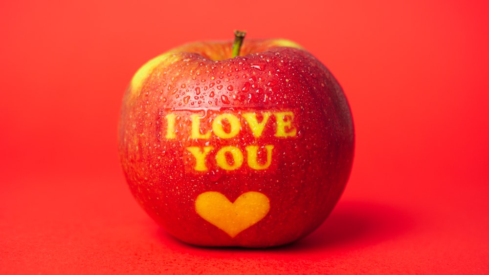red and white i love you printed apple