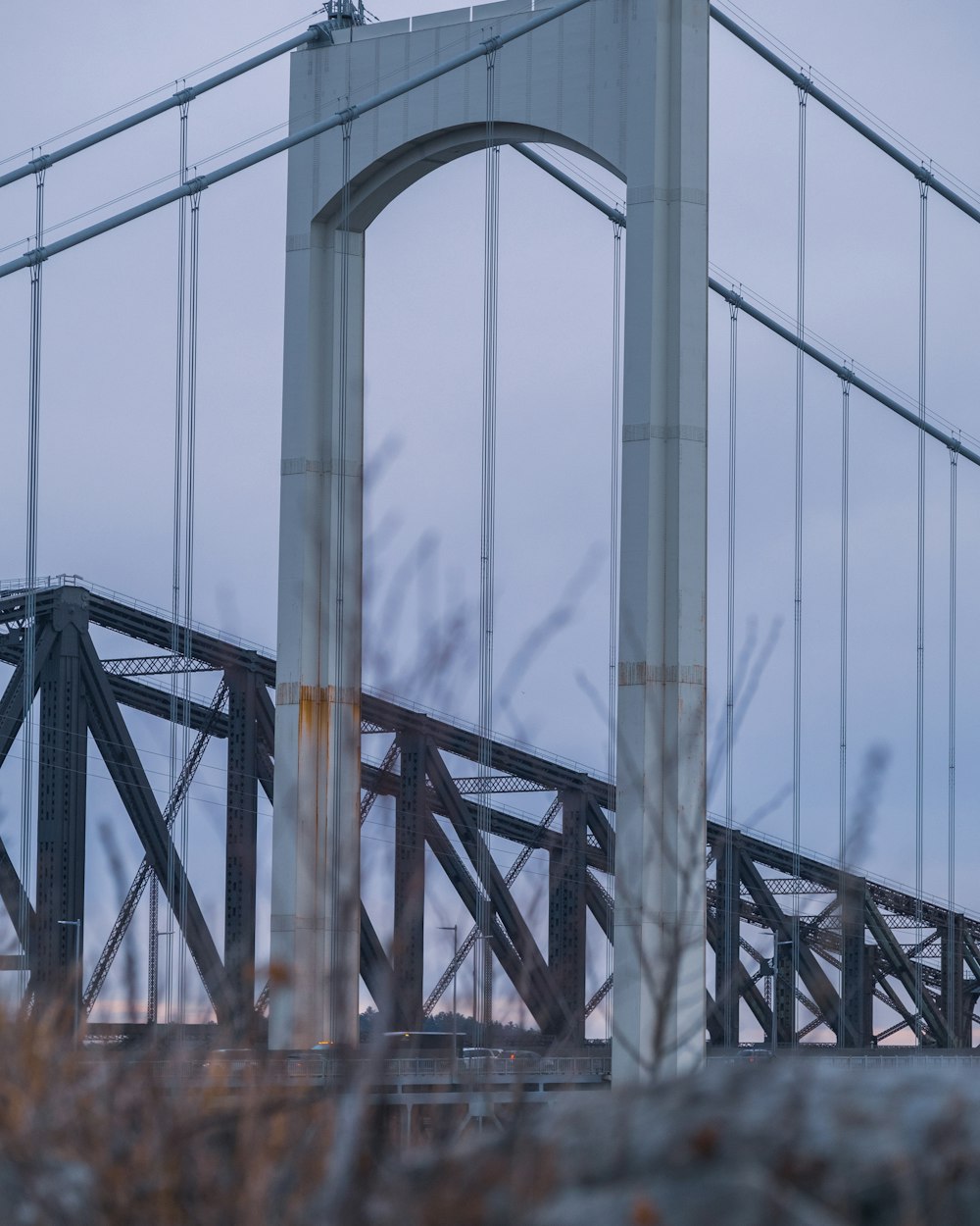 gray metal bridge under blue sky during daytime