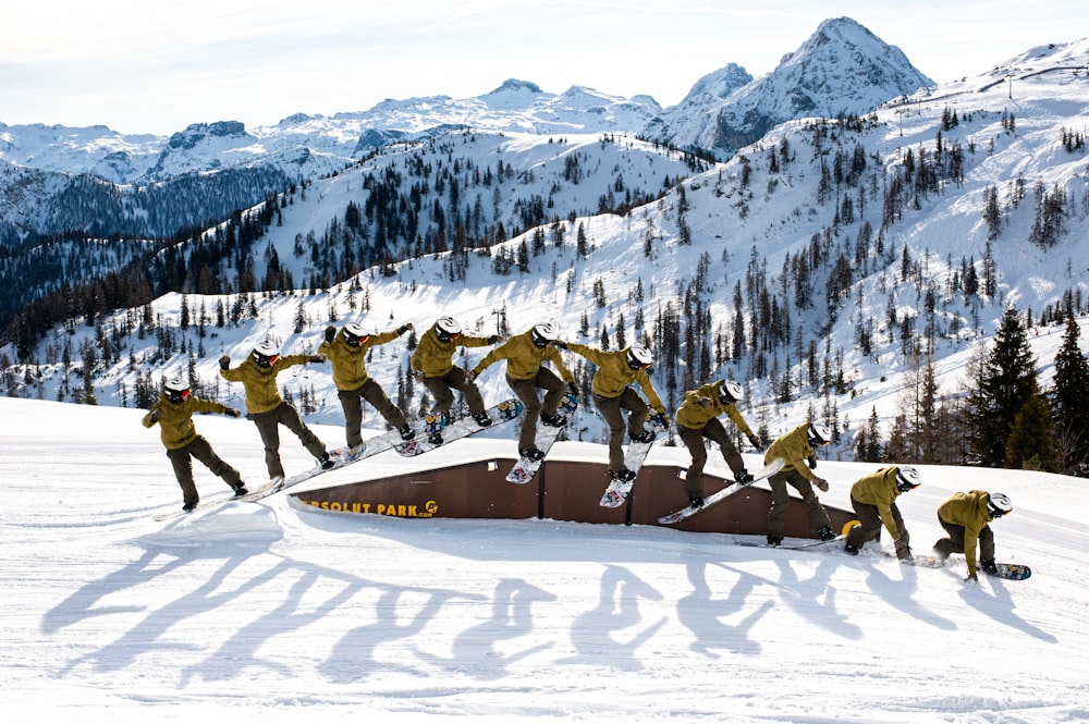 people riding ski lift on snow covered mountain during daytime