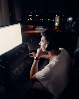 Night shift call center agents working on computers with headsets