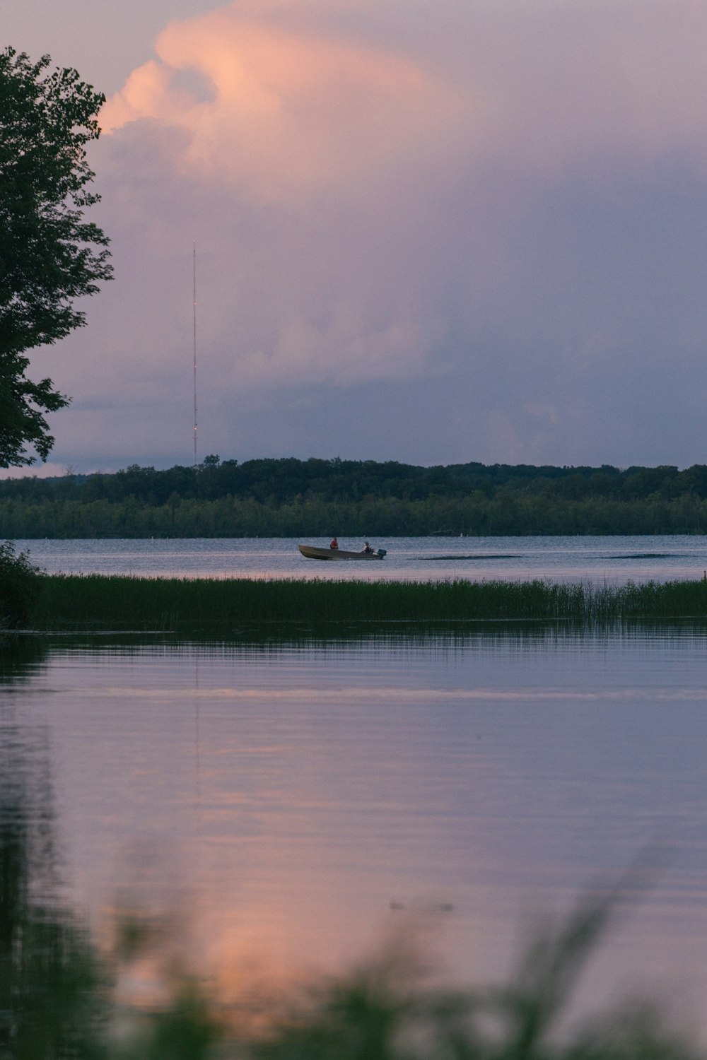 white boat on lake during daytime