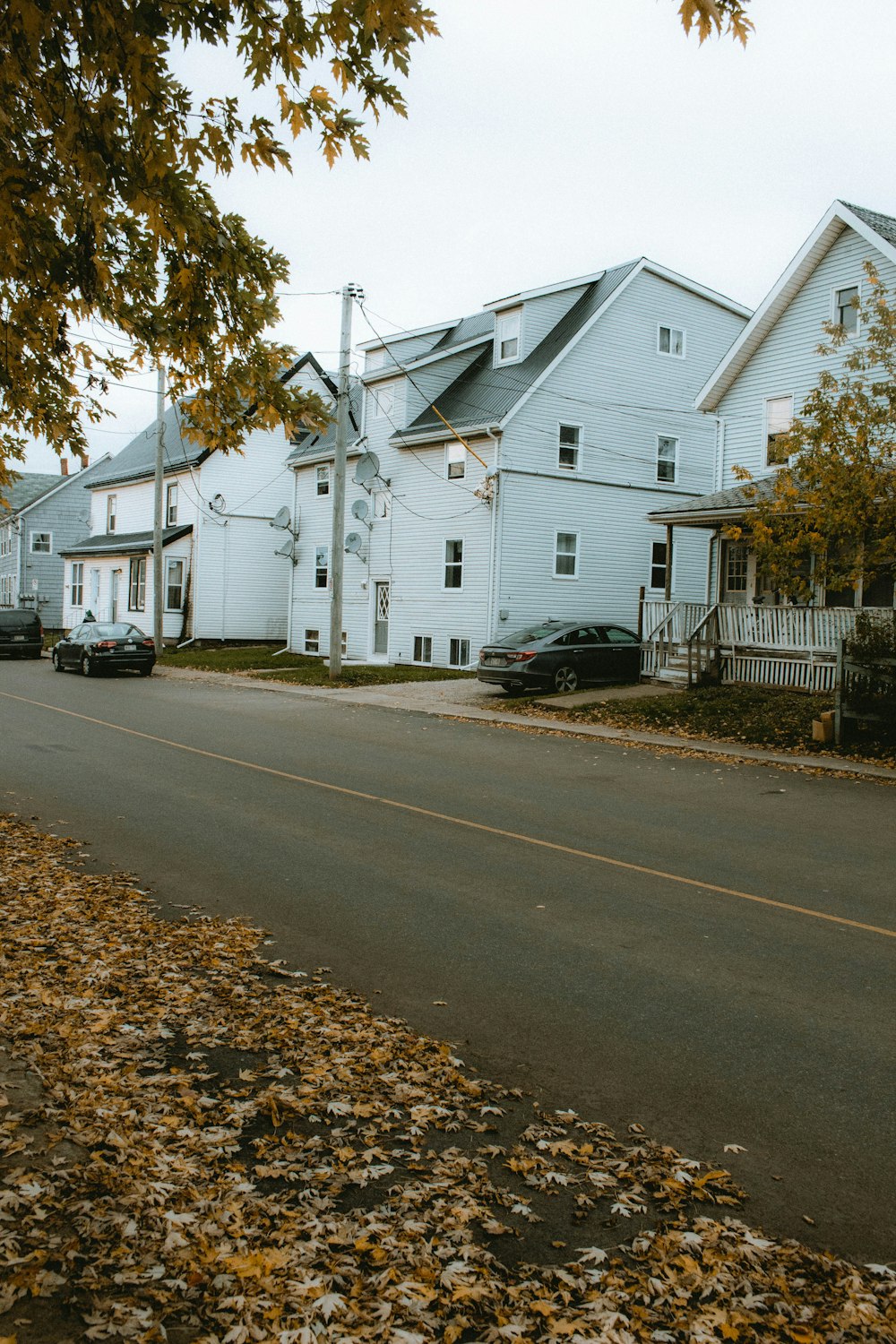 white wooden house beside road during daytime