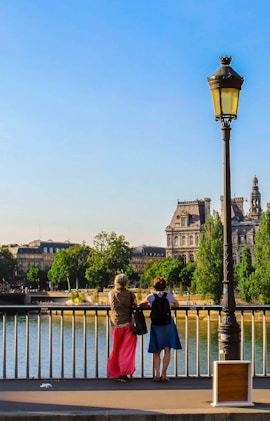 people standing near body of water during daytime