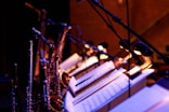 brass saxophone on white music stand