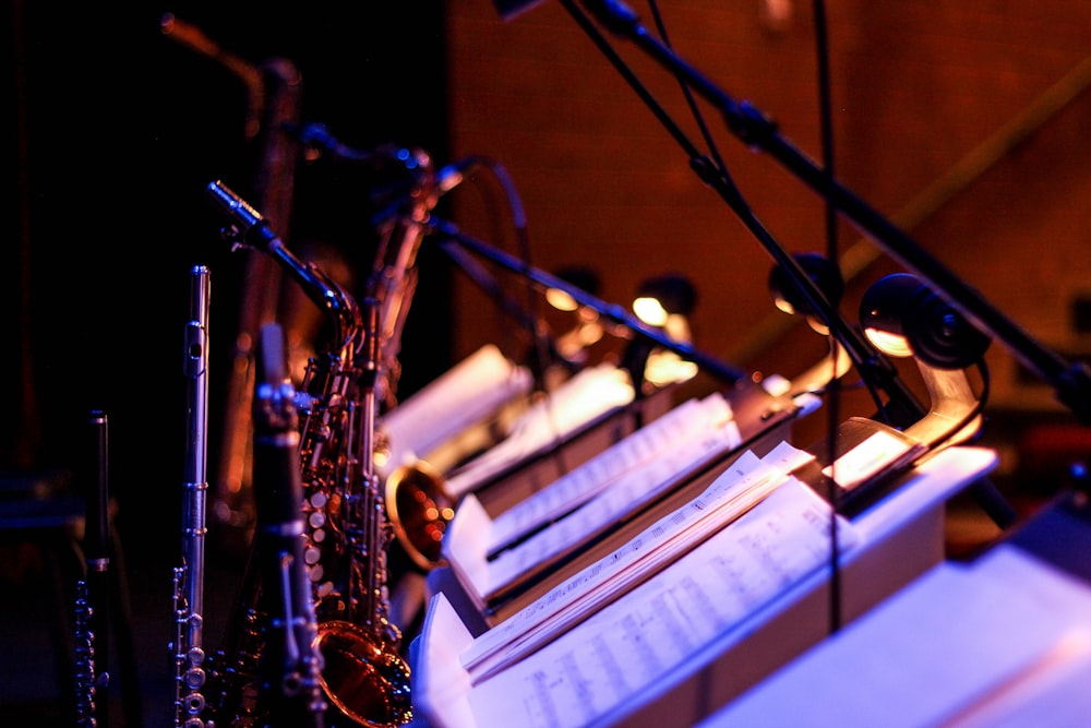 brass saxophone on white music stand