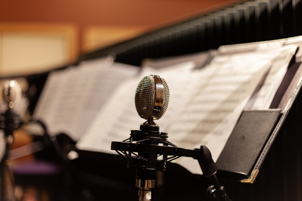 black and silver microphone on black tripod