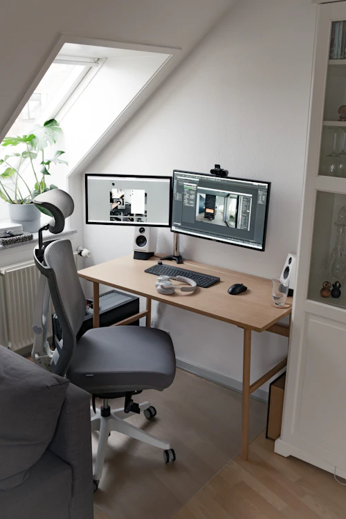 Black flat-screen computer monitor on a wooden desk