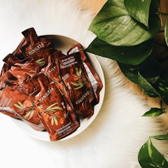 A cozy home delivery package with natural supplements and green leaves around.