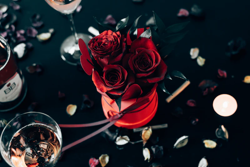 Deep red roses with candlelight and gold
