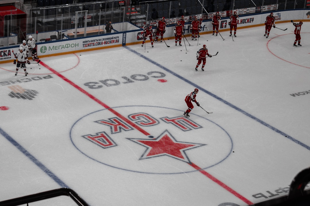 people playing ice hockey on court