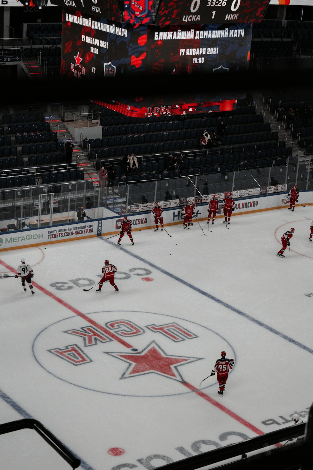 people playing ice hockey on ice stadium