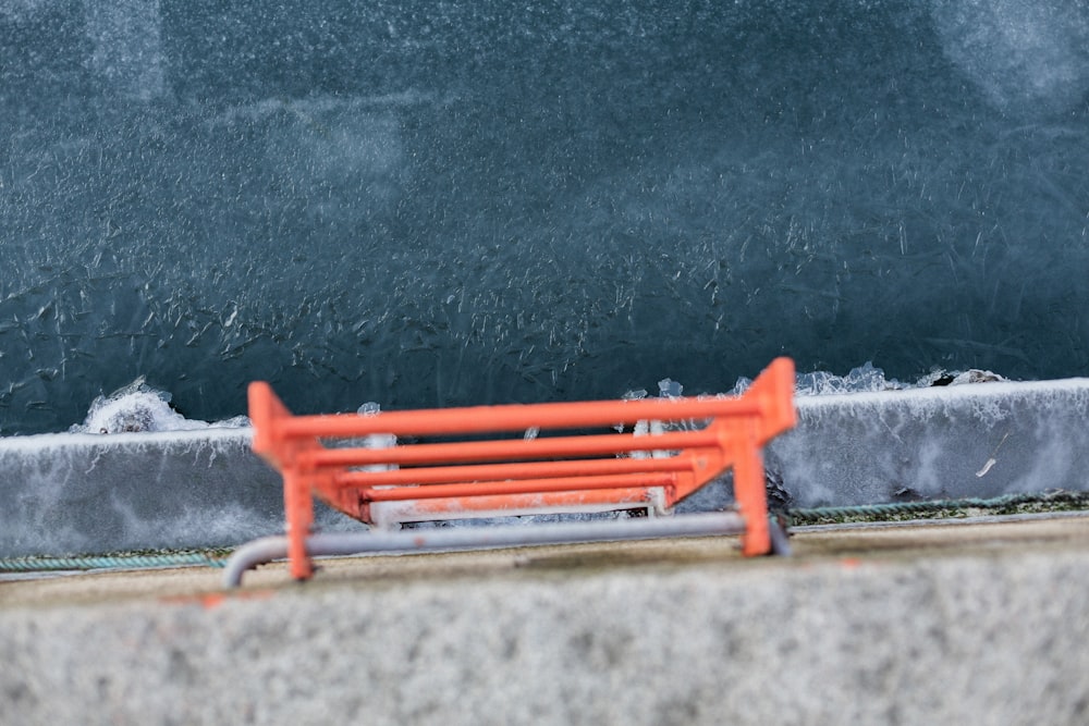 red metal frame on gray concrete floor