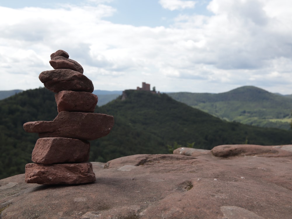 brown rock formation on brown field during daytime