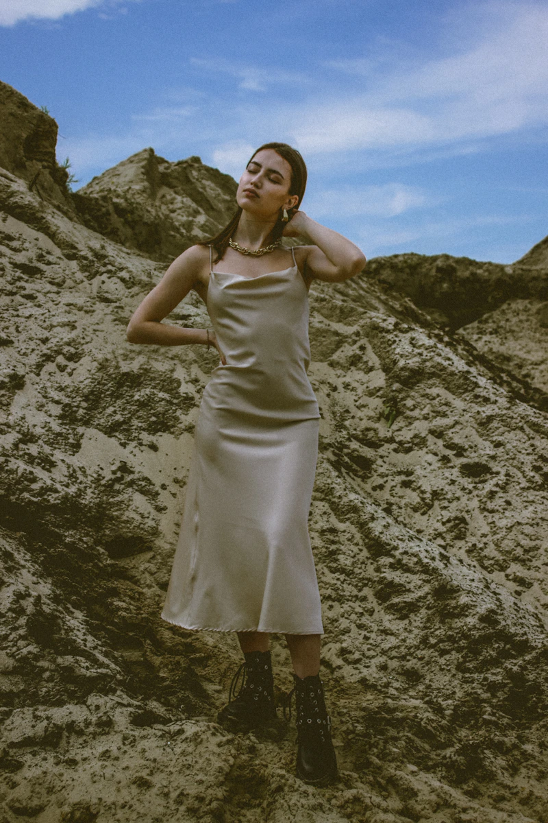 Elegant woman in flowing satin slip dress editorial shot