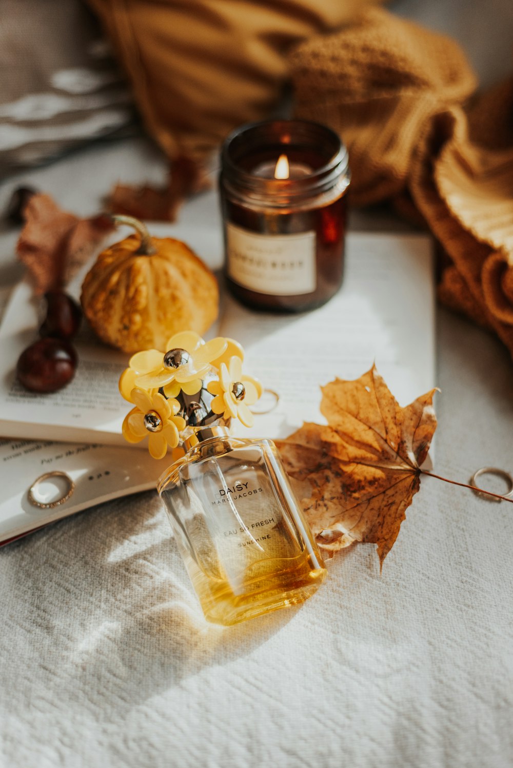 brown dried leaves beside brown glass bottle