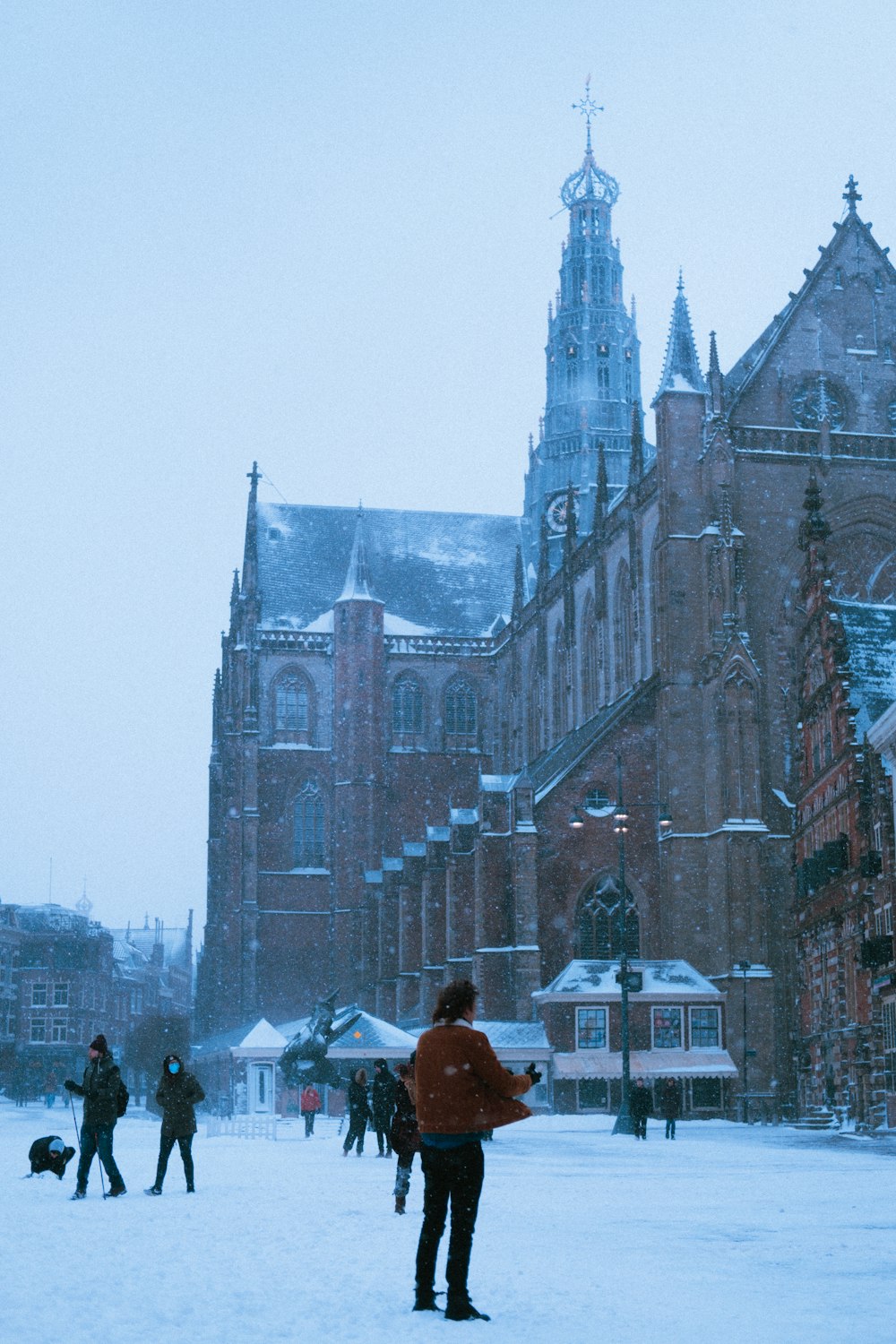 people walking near brown concrete building during daytime