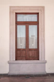 A sleek thermal door curtain hanging neatly in a modern doorway.