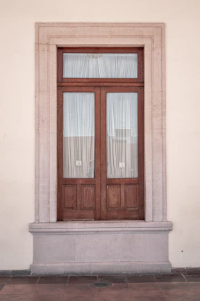 A sleek thermal door curtain hanging neatly in a modern doorway.