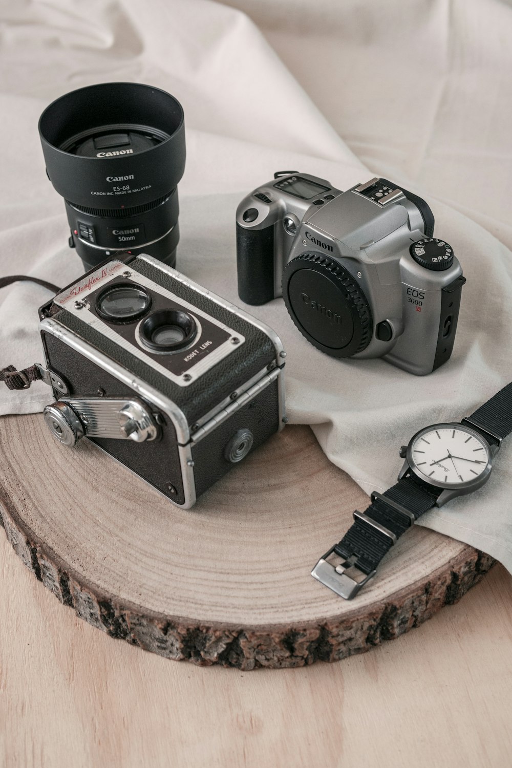 black nikon dslr camera on brown wooden table