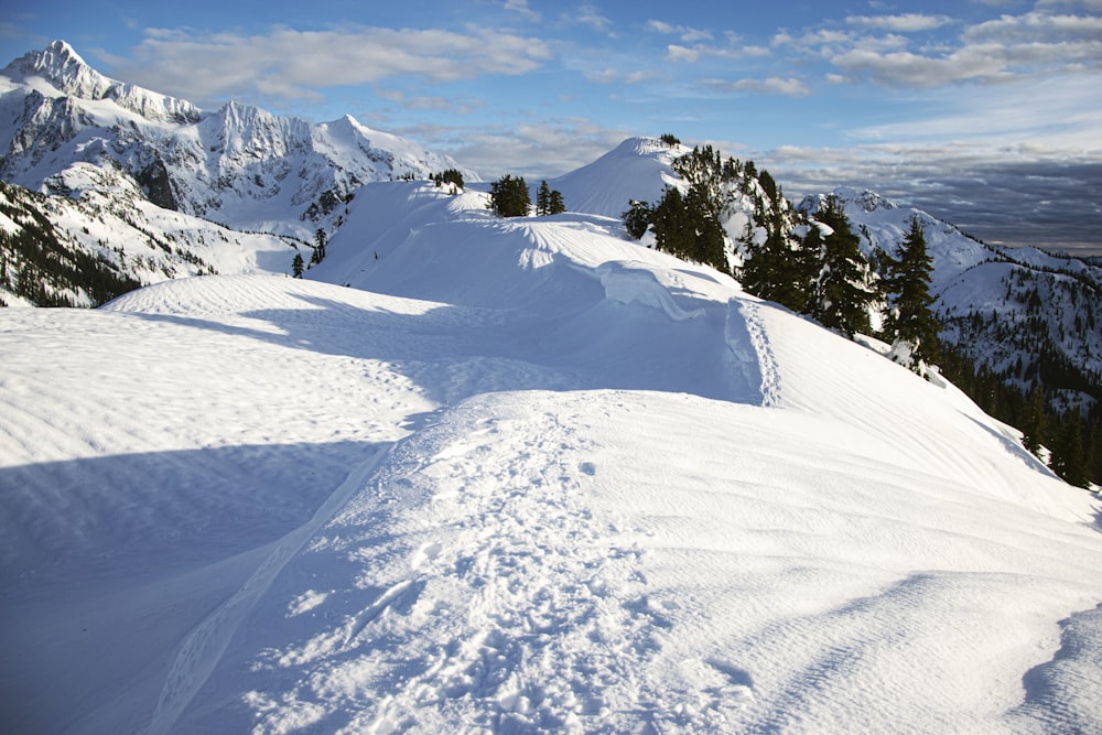 snow covered mountain under blue sky during daytime