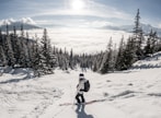 person in red jacket and blue pants riding ski blades on snow covered ground during daytime