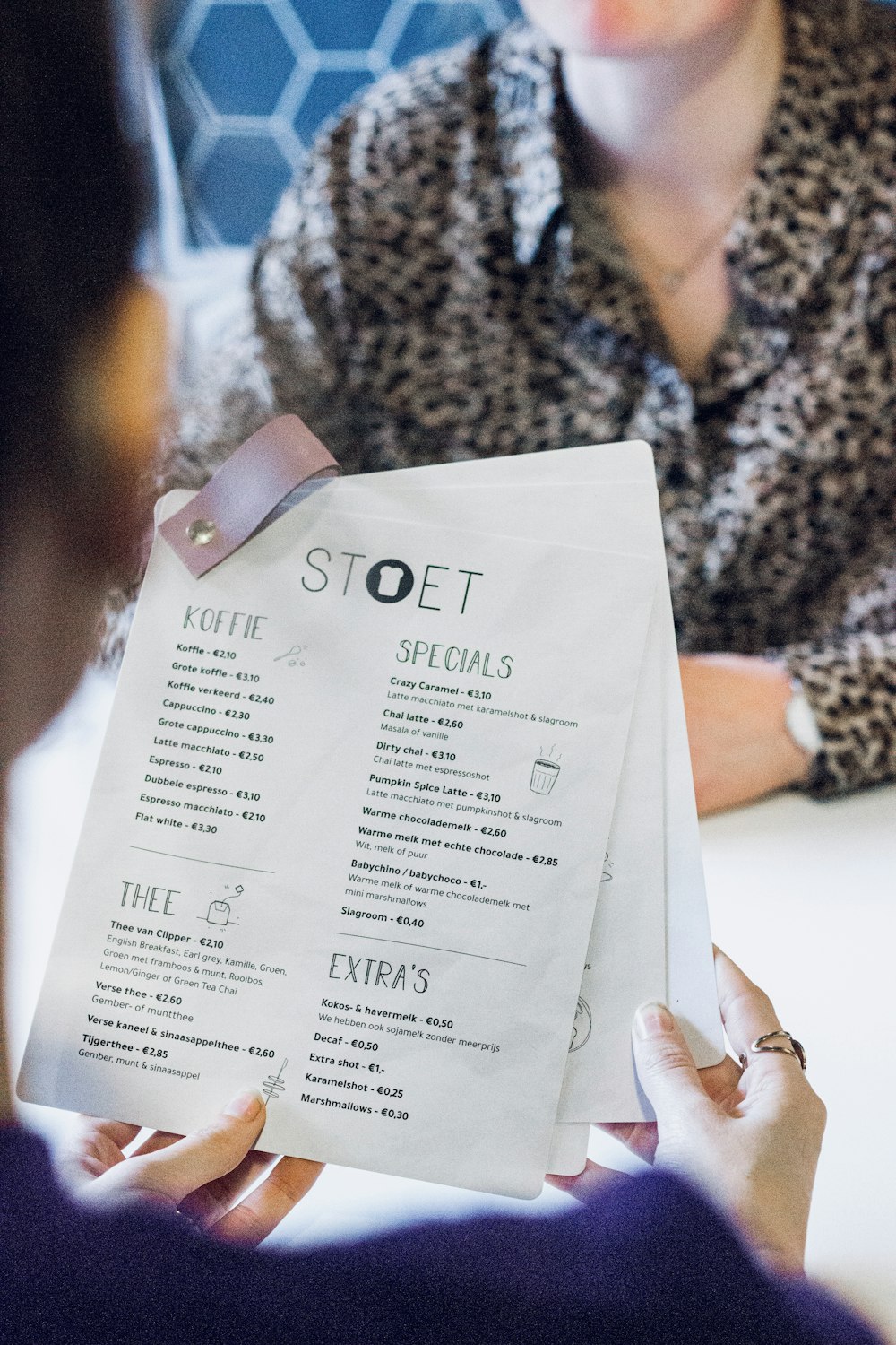 person holding white printer paper