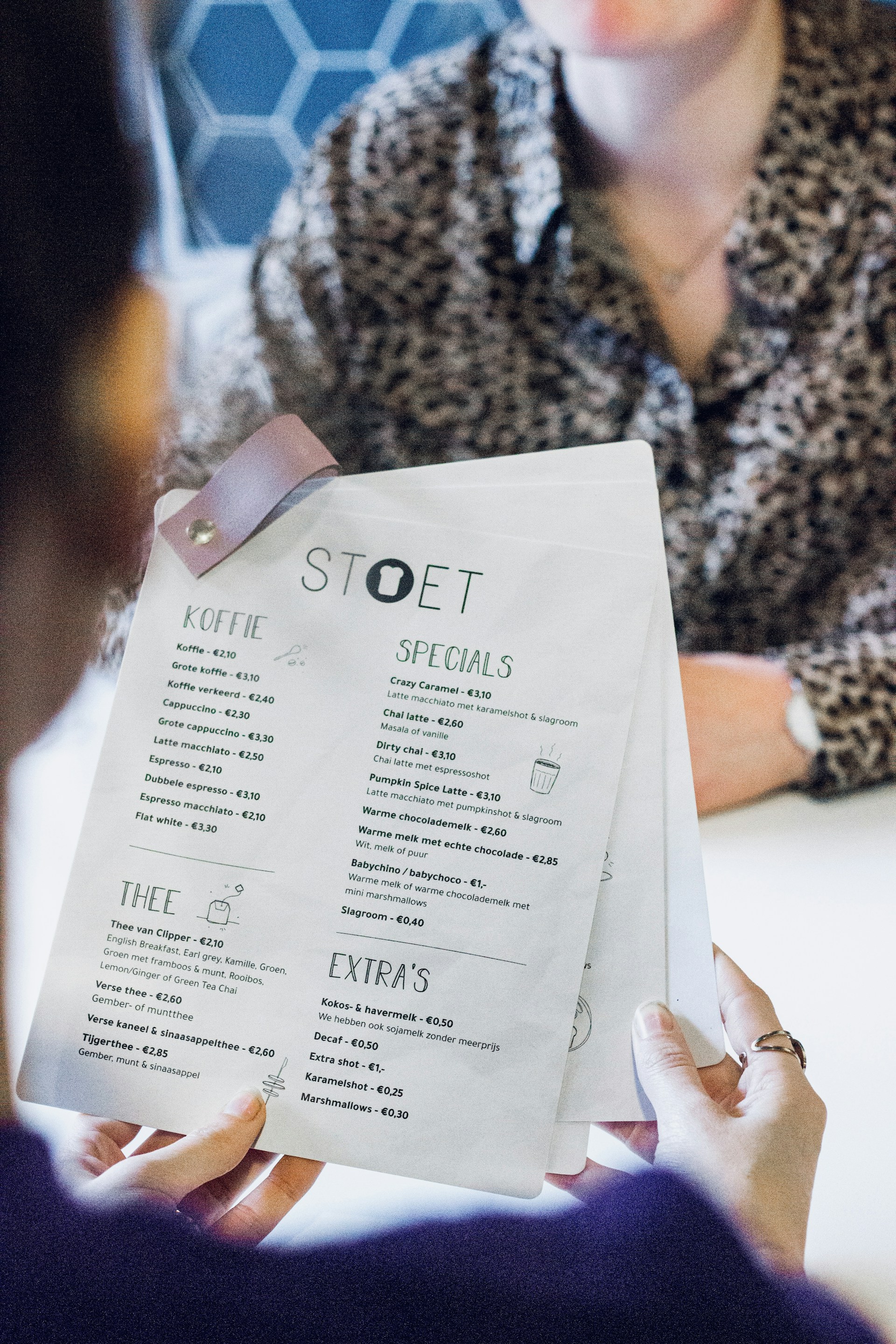 person holding white printer paper