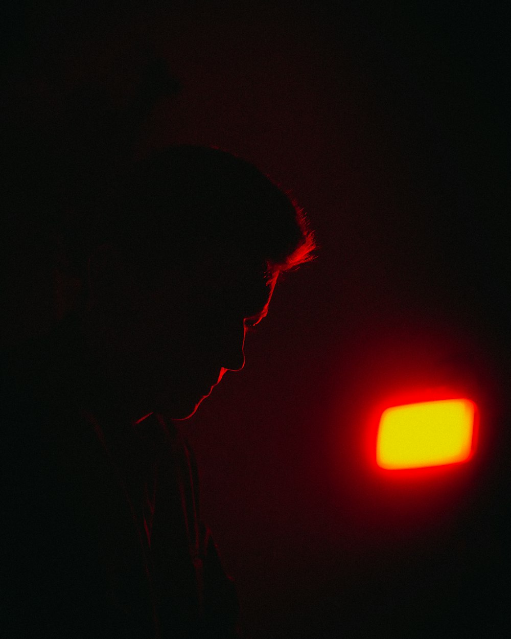 silhouette of man looking at the right side