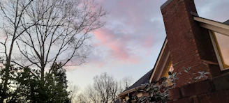 Evening shot of a home with a freshly serviced chimney.