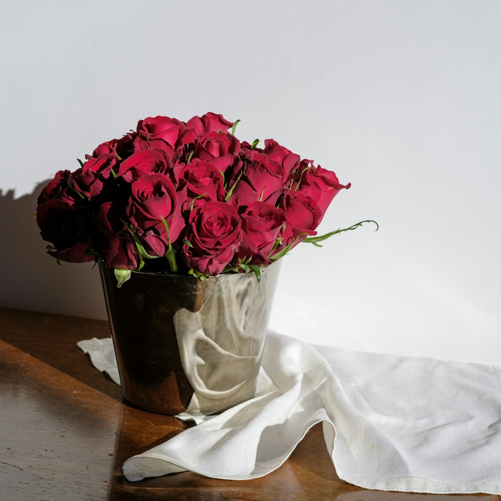 bouquet of red roses on white textile photo – Free Flowers in pot Image on Unsplash