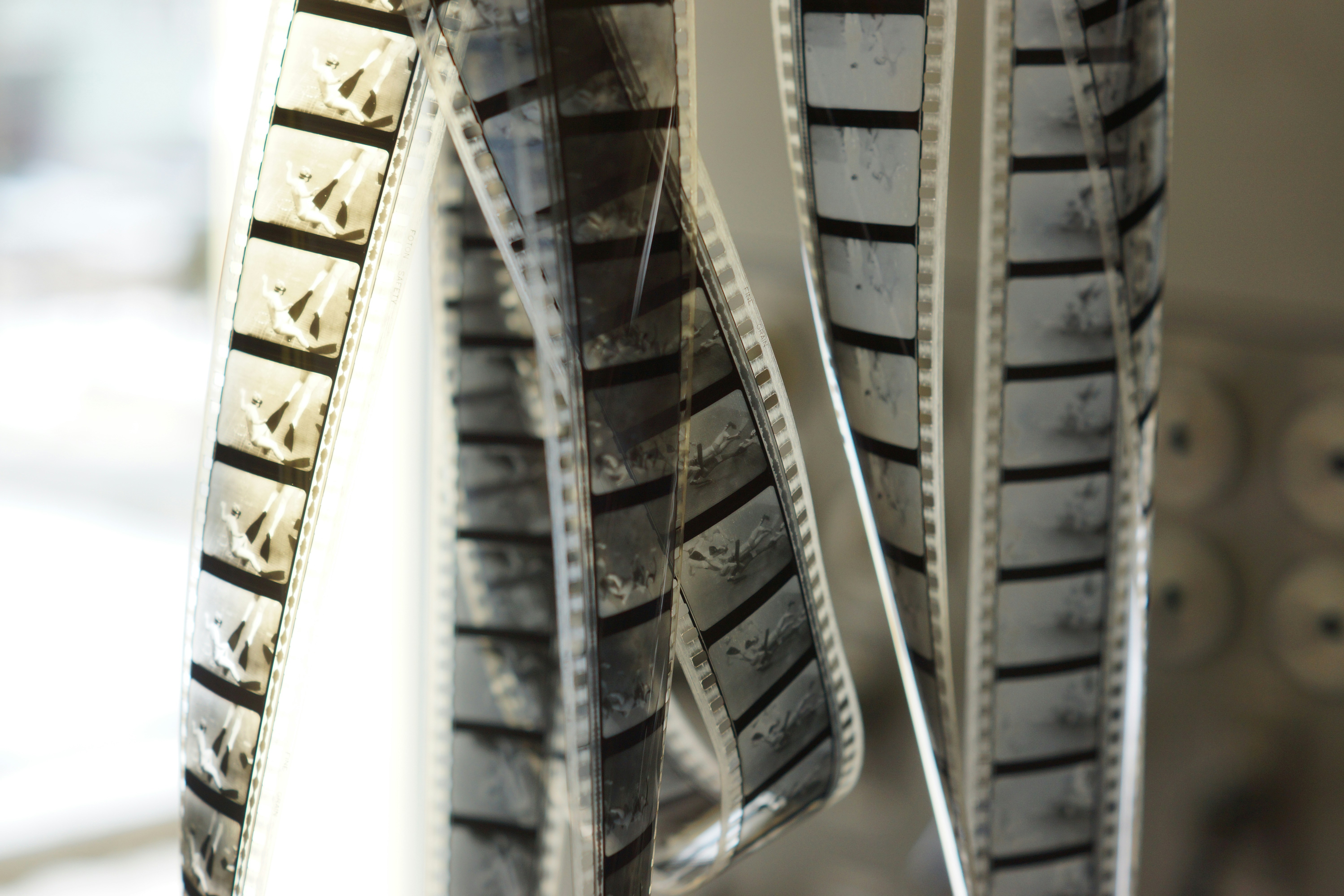 Closeup of an electric car’s all-season tire tread pattern on a wet road