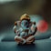 gold baby figurine on black textile
