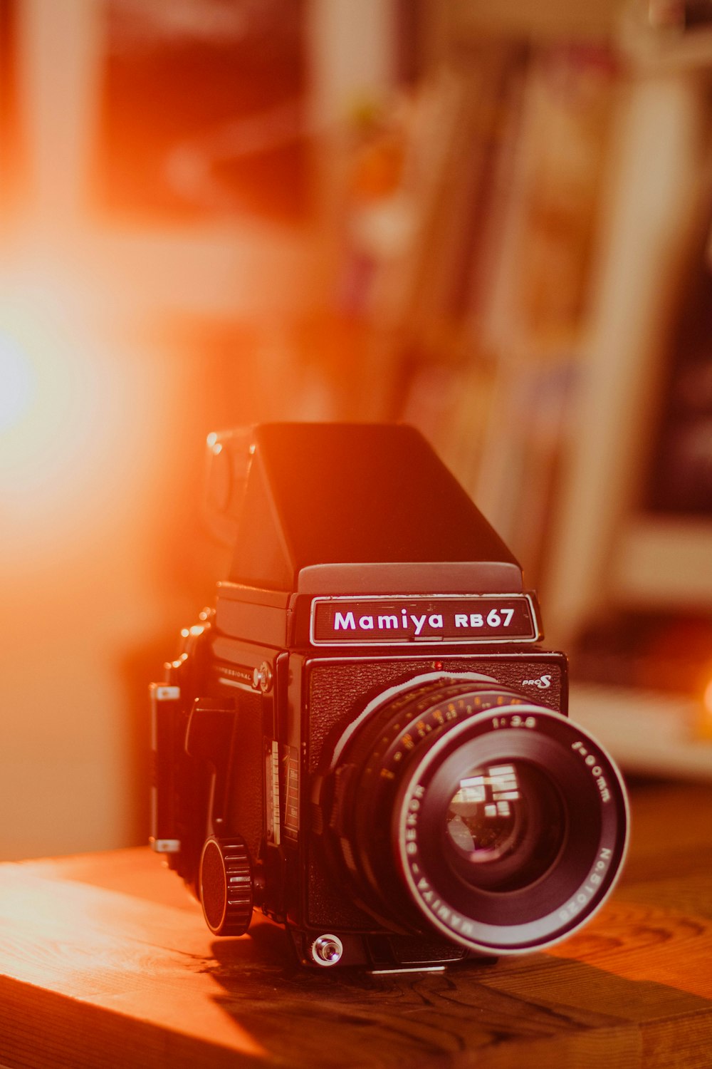 black nikon dslr camera on brown wooden table