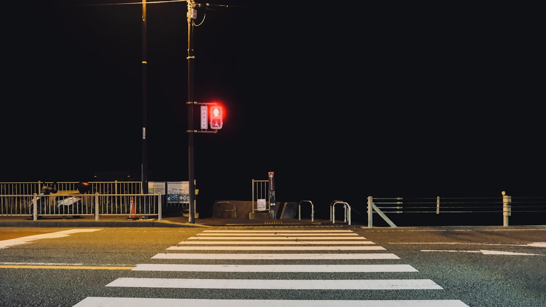 red light on the road during night time